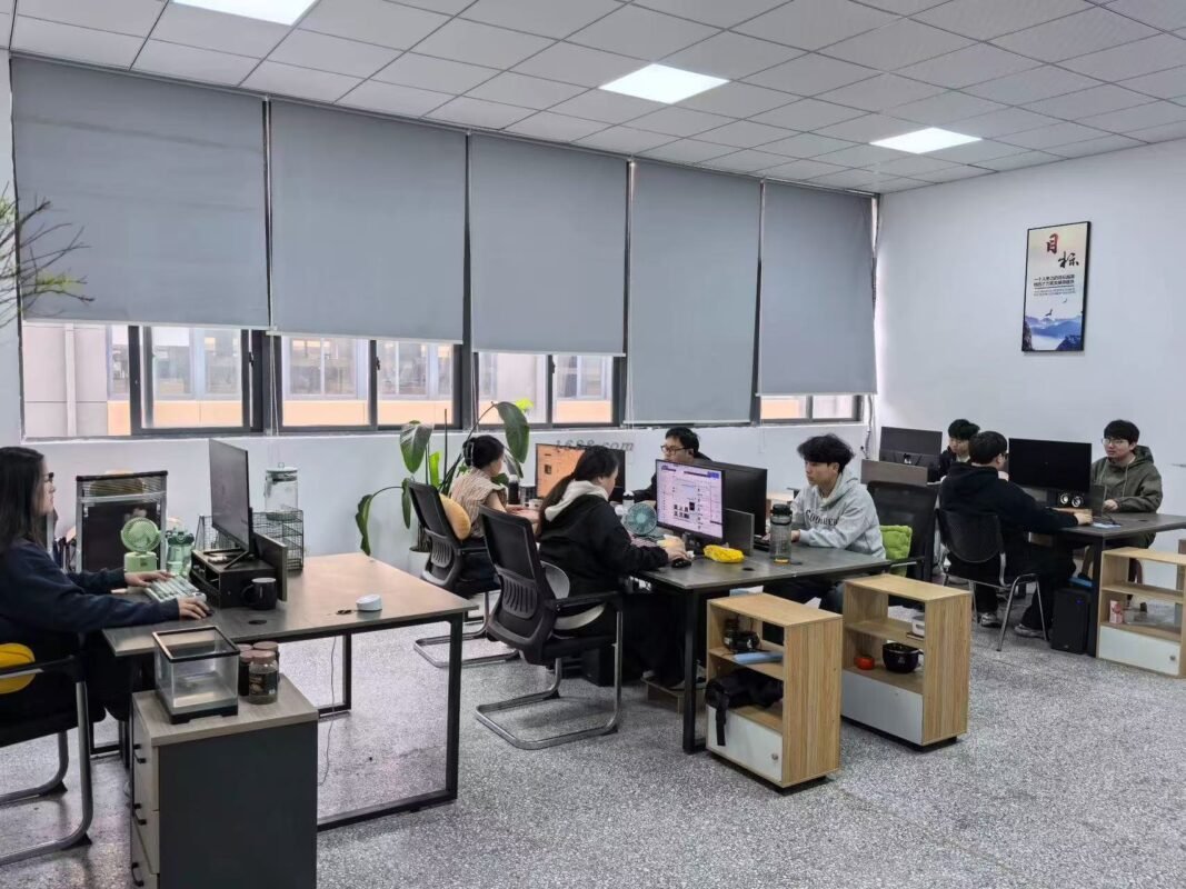 YASSIA team working in the company office shown in the existing brand media library